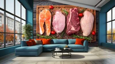 Mix of raw meat and fish . Salmon , beef , pork , chicken staek . Top view Wall mural