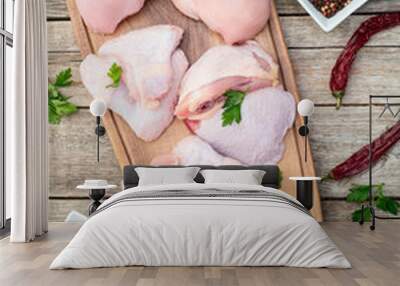 Raw mixed chicken meat parts  for cooking on rustic background Wall mural