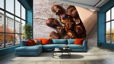 Tasty fried chestnut snack background Wall mural