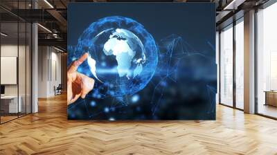 A hand interacting with a digital globe overlay on a city background, illustrating a connectivity concept Wall mural