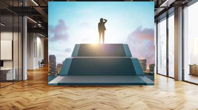 Back view of young european businesswoman standing on top of stairs on bright city background with sky view. Leadership, growth and success concept. Wall mural