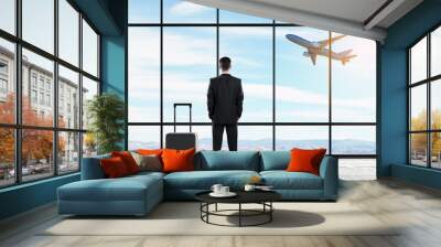 Businessman in airport Wall mural