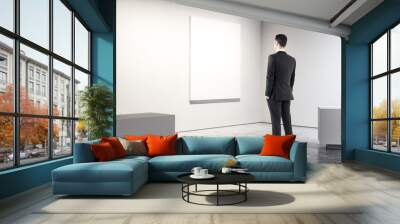 Businessman in modern gallery Wall mural