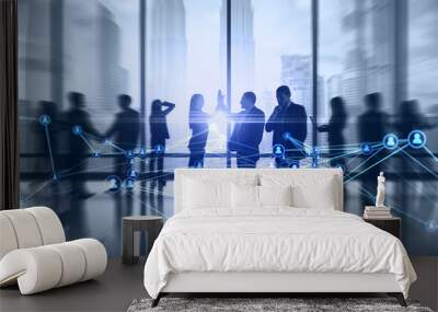 Businesspeople working together in bright office with abstract glowing polygonal network with people icons and blurry city view. Online networking, multimedia, digital communication concept.  Wall mural