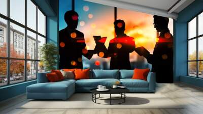 Businesspeople working with laptops in an office at sunset with bokeh lights overlay. Wall mural