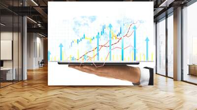 Businessperson's hand holding tablet displaying financial growth charts, data graphs on white background. Concept of market analysis and investment Wall mural