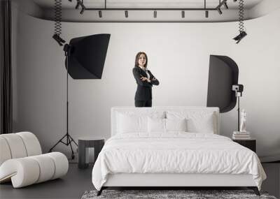 Businesswoman in photo studio Wall mural