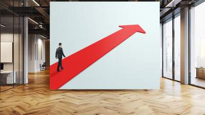 Career growth and road to success concept with businessman perspective view walking on red arrow on abstract light grey background Wall mural