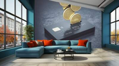 Cashback loyalty programm concept with metal coins bound for a stack of black credit cards on abstract dark surface Wall mural