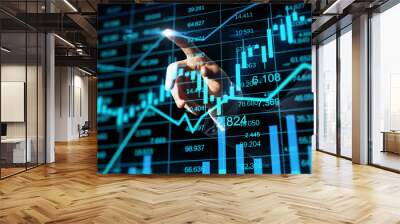 Close up of businessman hand pointing at glowing business chart hologram and index on blurry background. Finance, trade and invest concept. Double exposure. Wall mural