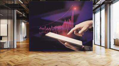 Close up of businessman hand pointing at tablet with abstract glowing growing global business chart on blurry officr desktop background. Financial growth and trade concept. Double exposure. Wall mural