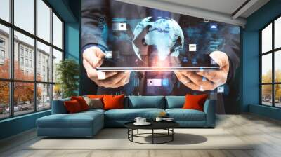 Close up of businessman hands holding tablet with creative glowing globe hologram grid interface on blurry background. Digital transformation, innovation and future concept. Double exposure. Wall mural