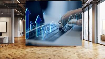 Close up of male hand using laptop with creative growing forex chart with arrow on blurry background. Financial growth and stock concept. Double exposure. Wall mural