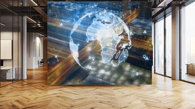 Creative glowing polygonal globe hologram with icons on blurry night city background. Global technology and internet concept. Double exposure. Wall mural