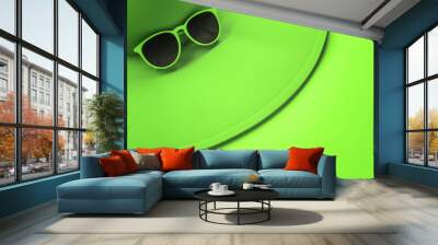 Green hat and sunglasses Wall mural