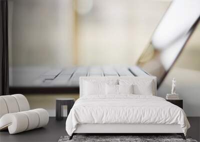 modern laptop on a glass table, shallow depth of field Wall mural