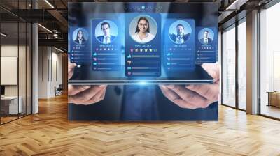 Online recruitment application and one day specialist search service concept with virtual personal cards with rating projected from digital tablet in man hands Wall mural