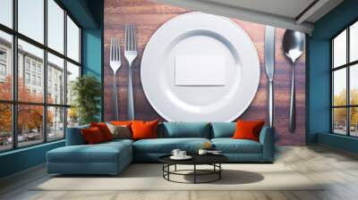 Plate with business card closeup Wall mural