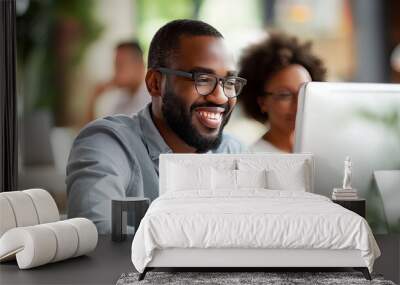 Smiling man with glasses using a computer, woman behind, blurred cafe background, concept of work satisfaction. Generative AI Wall mural