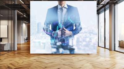 Stock market and investing concept with double exposure of businessman on city background and digital financial candlestick and graphs Wall mural