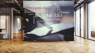 Tablet with business text Wall mural