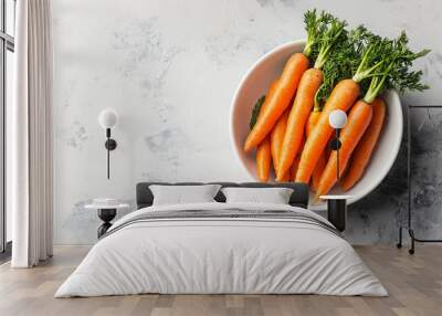 Mini carrots in white bowl, baby carrot, white background, space for copy, text or caption Wall mural