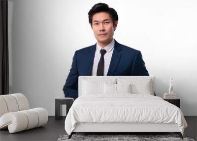 asian business man confident elegant handsome smart asian young man standing in front of a white background in a studio wearing a nice suit business leadership ideas concept Wall mural