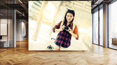 beautiful happiness young asian girl in casual dress traveling alone at train station or airport wit Wall mural