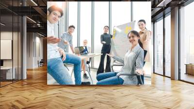 Group of asian young creative happy enjoy laugh smile and great success emotion teamwork people business startup entrepreneur casual brainstorm business meeting office background Wall mural