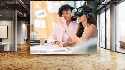 group of millennial male and female multiethnic using vr goggle to test metaverse meeting system cheerful and smiling,office friend standing discussion together next to window office background Wall mural