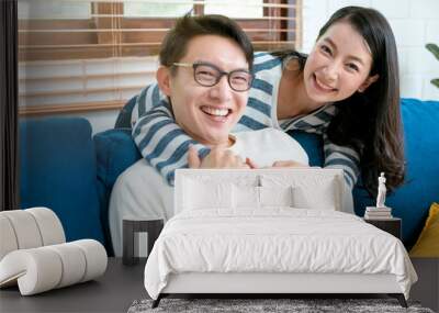 sweet lovey asian family couple sit talk good conversation on sofa in living room house background Wall mural