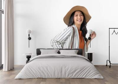 traveller adult attractive cheerful smiling asian female wear casual cloth with hat and purse ready to travel in summer time vacation ideas concept isolate white background Wall mural