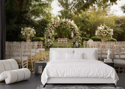 Show a beautiful outdoor wedding in a private garden, with a romantic floral arch, elegant white chairs, and a reception area featuring classic wooden tables and soft lighting. Wall mural