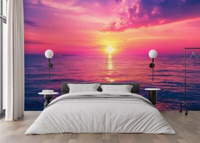 The beauty of a sunset over the sea is unparalleled, with the sky painted in hues of orange, pink, and purple. Wall mural