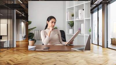 Stressed Business Woman Working at Desk in Modern Office with Documents and Laptop Wall mural