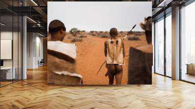 original native bushman from Namibia with traditional clothing from behind Wall mural