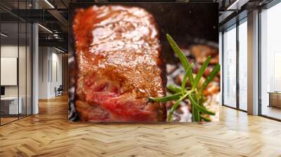 Juicy beef steak and herbs spices on cast iron skillet pan Wall mural