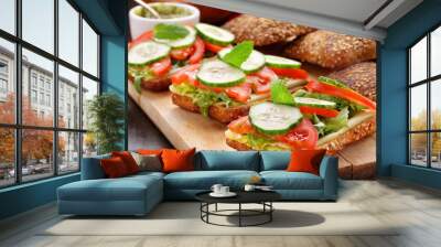 Vegetarian sandwich with pesto on wooden background Wall mural