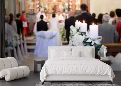 young couple during the wedding ceremony before the altar in a c Wall mural