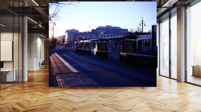 Early winter morning on a tram stop with strong sunlight on the Avenue, Gothenburg, Sweden Wall mural