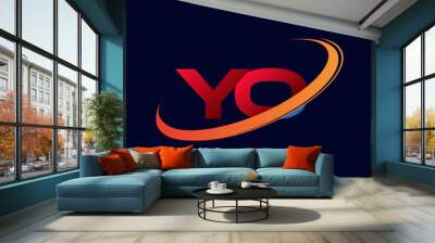 initial letter YO logotype company name colored red and orange swoosh design. isolated on dark background. Wall mural