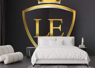 Initial logo letter LE with shield and crown Icon golden color isolated on black background, logotype design for company identity. Wall mural