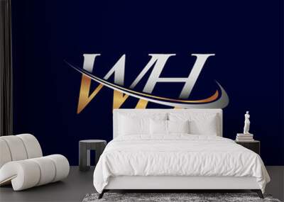 WH initial logo company name colored gold and silver swoosh design, isolated on white background. vector logo for business and company identity. Wall mural