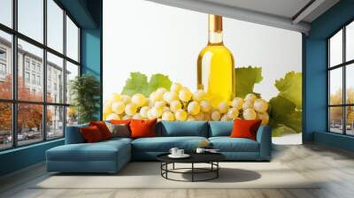 A bottle of white wine with clusters of grapes and green leaves, symbolizing freshness and harvest. Wall mural