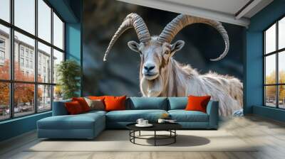 A close-up of a majestic animal with impressive horns in a natural setting. Wall mural