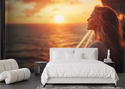 Woman watching the sunset from a cruise ship Wall mural