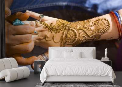 applying henna on hand, Hindu wedding ,Rajasthan, India Wall mural