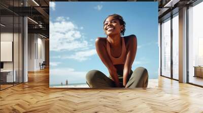 Fitness and Happiness: Black Woman Athlete Smiling After Running, Resting During Summer Marathon Training Workout Under Blue Sky Wall mural