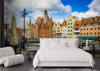 Beautiful city of Gdansk in the margins of the Motlawa river with the touristic boats and coloured buildings Wall mural