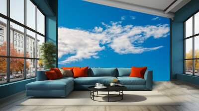 Clouds in a sunny winter day Wall mural